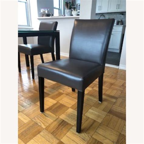 "Sleek Italian design cradles comfort with a gracefully curved back that hugs the body. . Crate and barrel chairs dining
